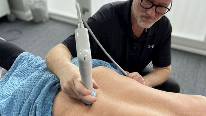 Shock wave therapy for back pain